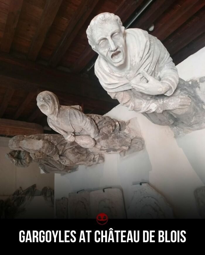 Weird and odd gargoyle statues with expressive faces inside Château de Blois, offering strange and intriguing photos.