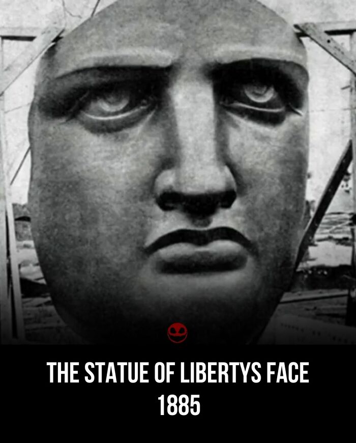 Close-up black and white photo of the Statue of Liberty's face from 1885 showing a weird and odd historical fact.