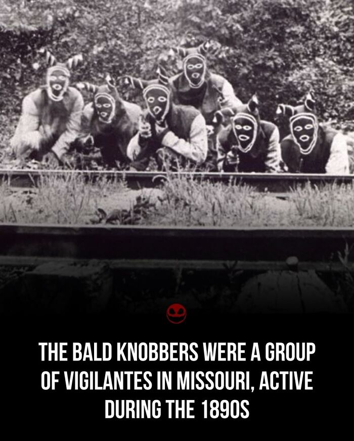Black and white photo of the Bald Knobbers, a vigilante group in Missouri from the 1890s, shown wearing masks.
