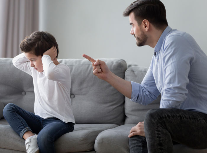 Father being a jerk to his child on the couch while mom shares her husband is awesome to her but harsh to kids.