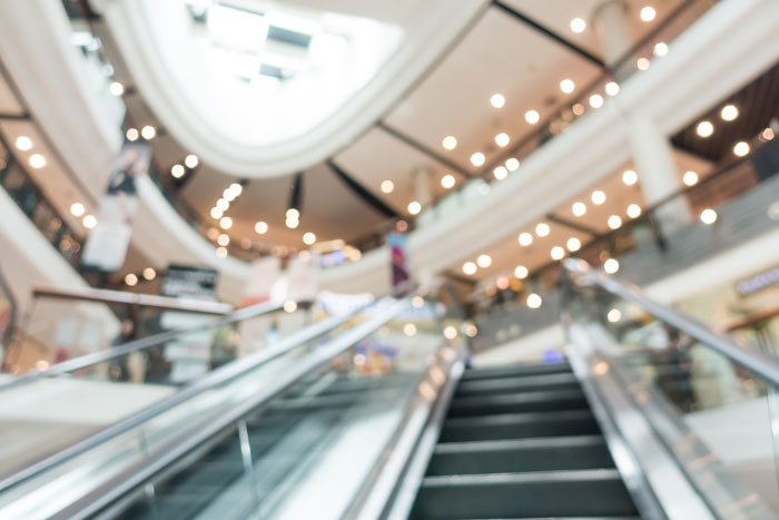 Blurred image of an empty shopping mall escalator symbolizing companies that didn’t think through social media campaigns.