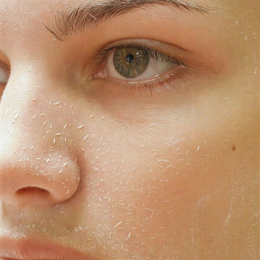 Extreme close-up of a face with flaky skin on the cheek and nose, illustrating bizarre human body quirks.