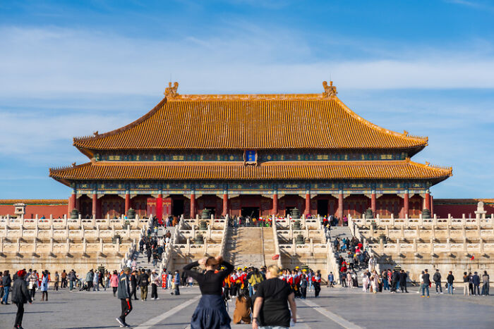 Forbidden City, Beijing, bustling with tourists, hinting at countries with the worst work-life balance.