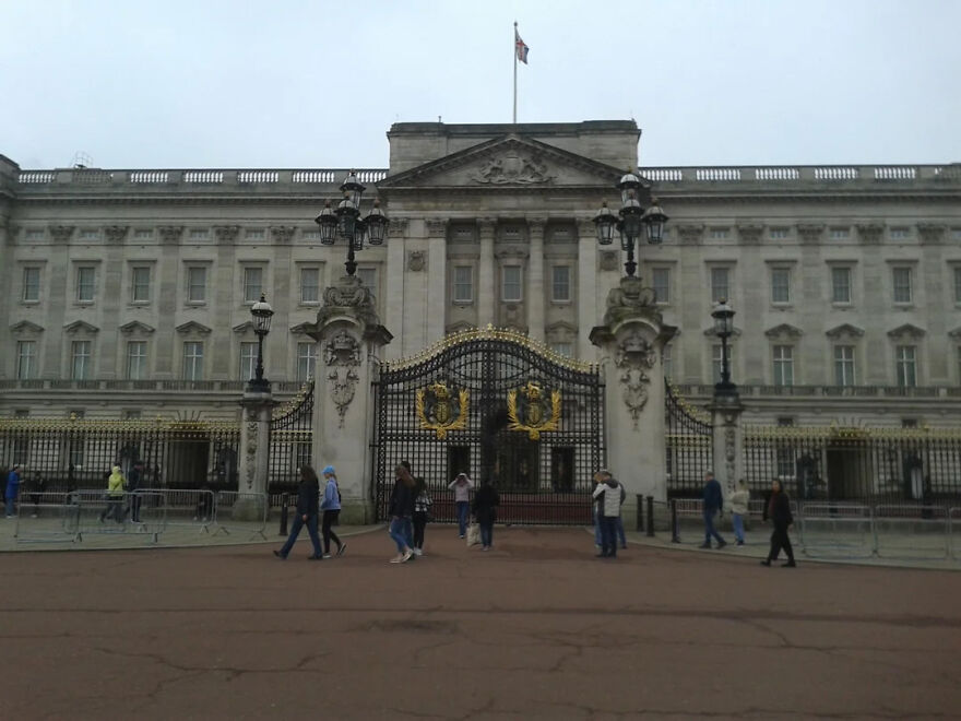 Buckingham Palace, a place with toughest security, featuring its ornate black and gold gates and iconic architecture.
