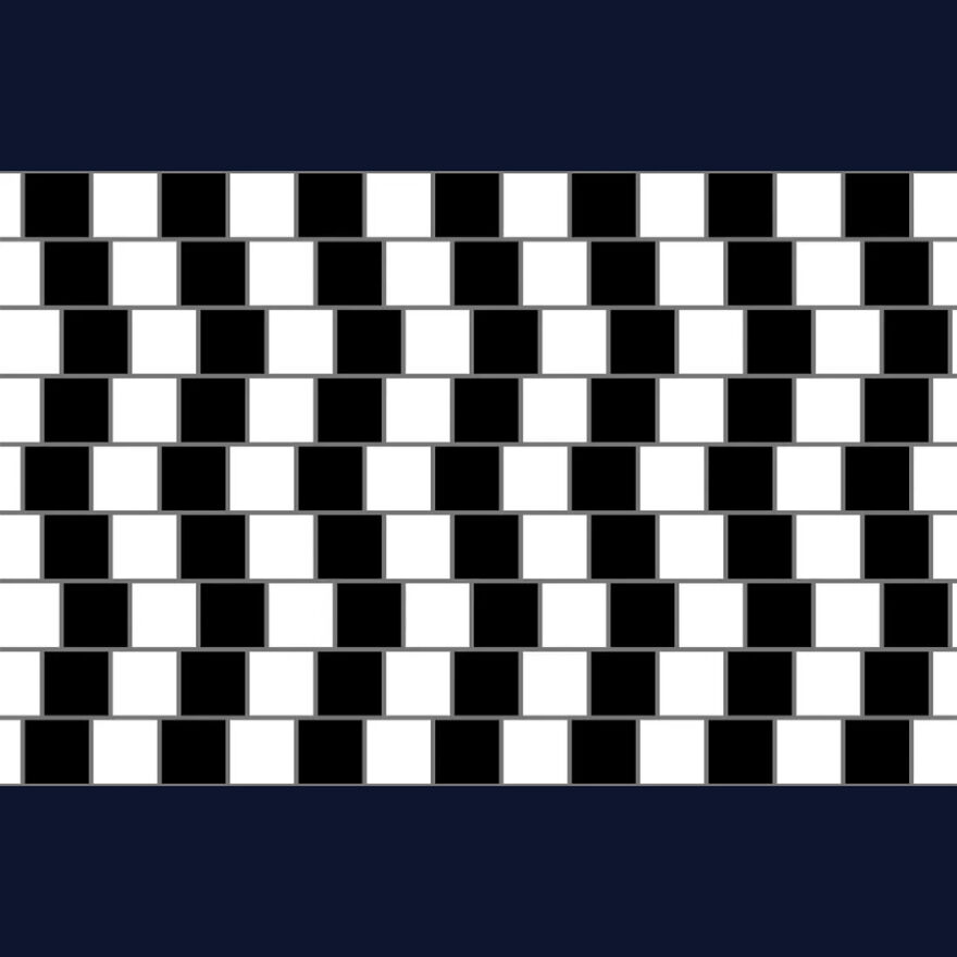 Brain-bending optical illusion: Cafe Wall pattern of black and white squares making straight grey lines appear crooked.