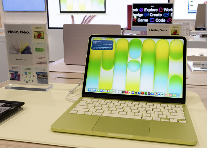 Laptop on display in a modern tech store, illustrating signs that suggest the economy is struggling.