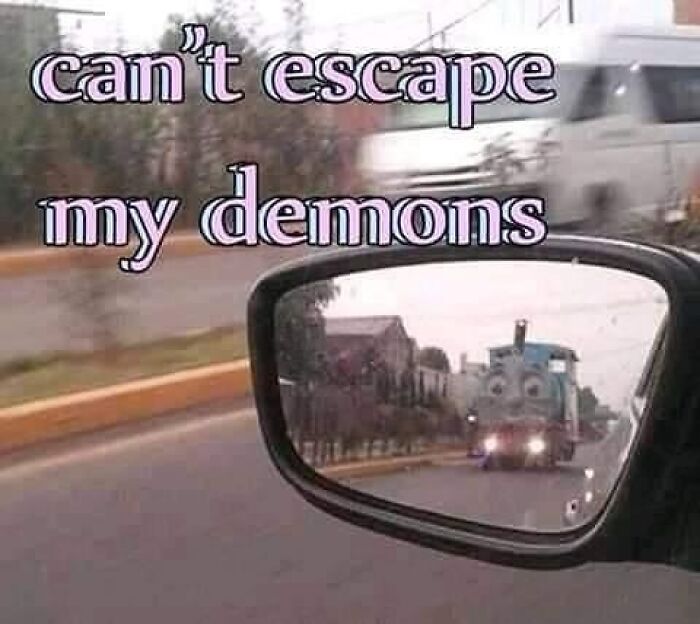 Car side mirror reflecting a creepy train face approaching, with text about escaping inner demons in a confusing, unhinged image.