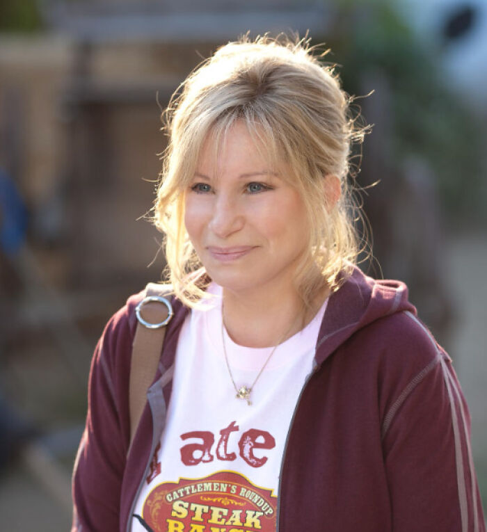 Woman in casual clothes smiling outdoors, representing PR mistakes and company backfire in a casual setting.