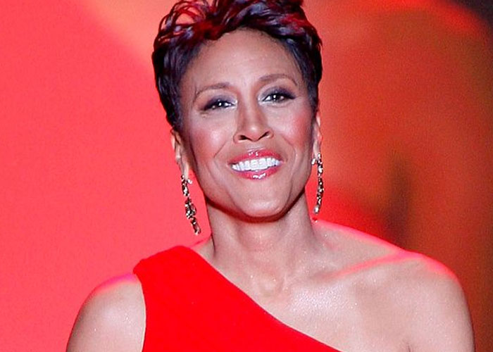 Smiling beloved celebrity in a red dress and earrings, representing beloved celebrities that are not that nice in real life.