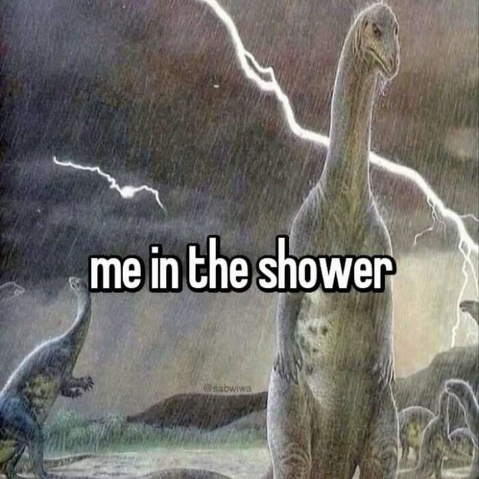 Dinosaur standing in the rain with lightning in the background, humorously captioned me in the shower, confusing and unhinged image.