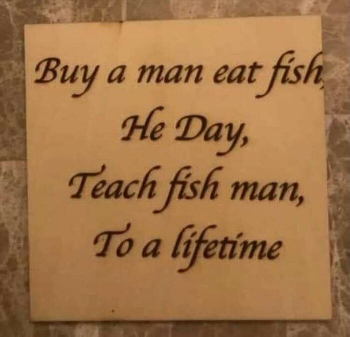 Confusing and unhinged image of a misspelled inspirational quote about teaching fish man shown on a tile plaque.