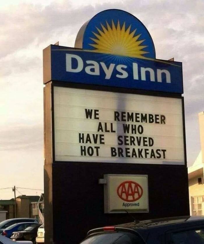 Days Inn sign with a confusing message that humorously honors those who served hot breakfast, highlighting unhinged images.