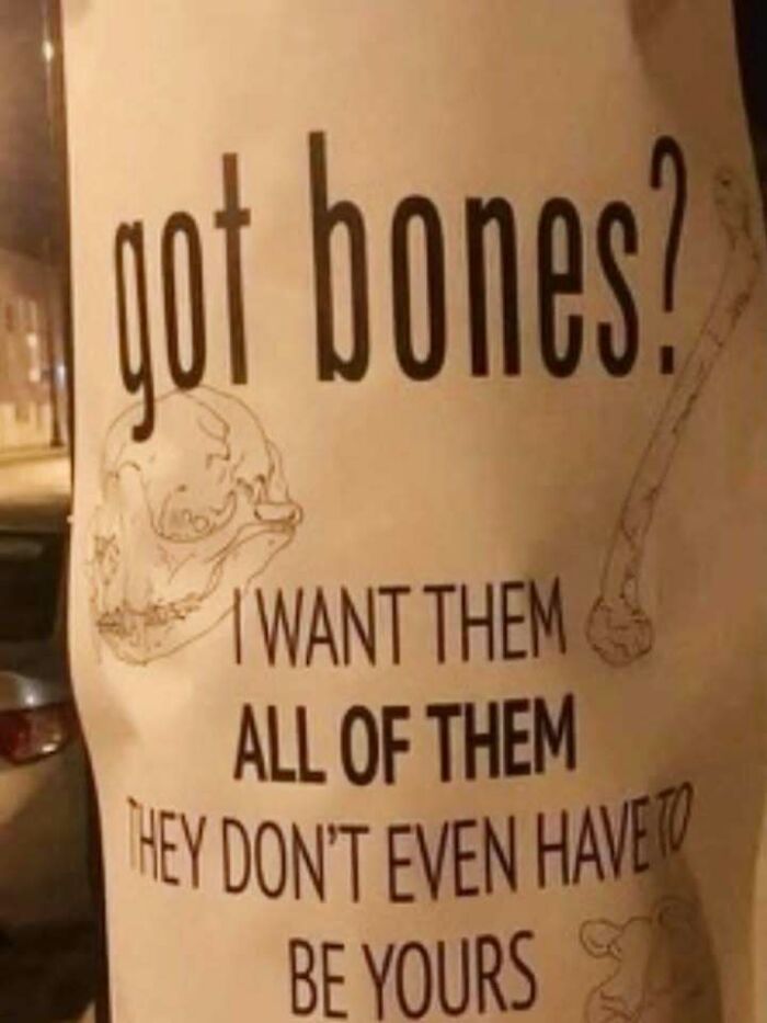 Sign with sketch drawings of bones and text saying got bones, I want them all, capturing a confusing and unhinged image concept.