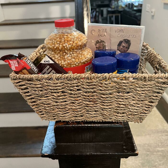 Woven Easter basket filled with snack items and small gifts as toy stuffers for Easter basket ideas by age.