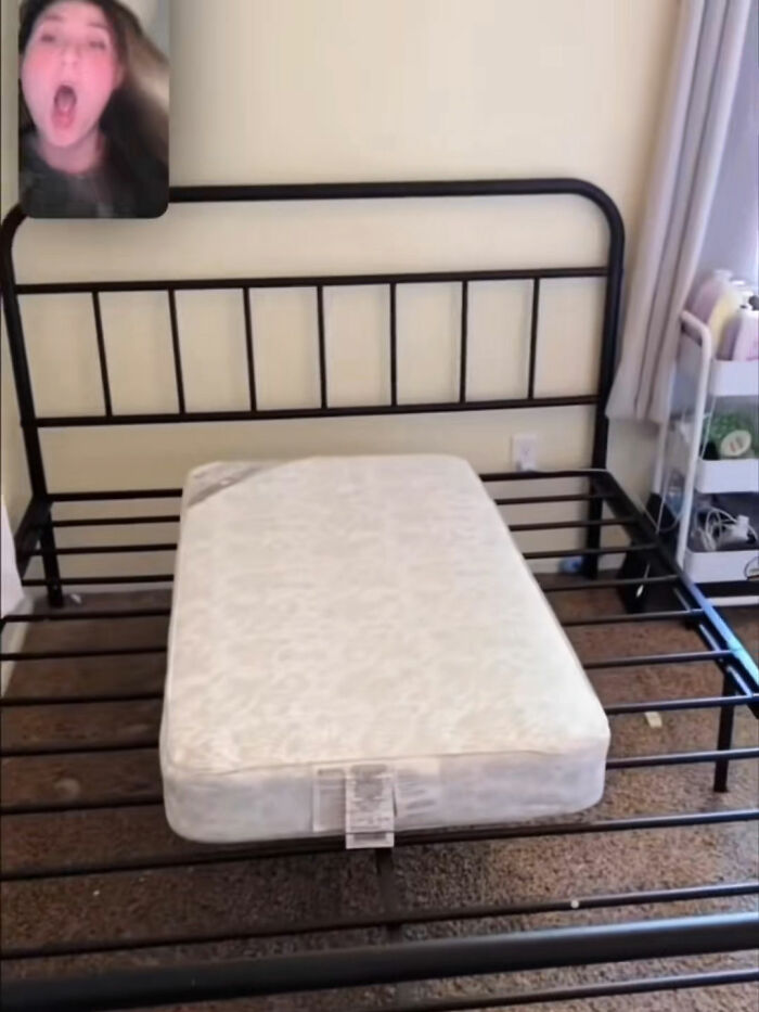 Small mattress mismatched with large metal bed frame illustrating a funny lesson from Temu orders.