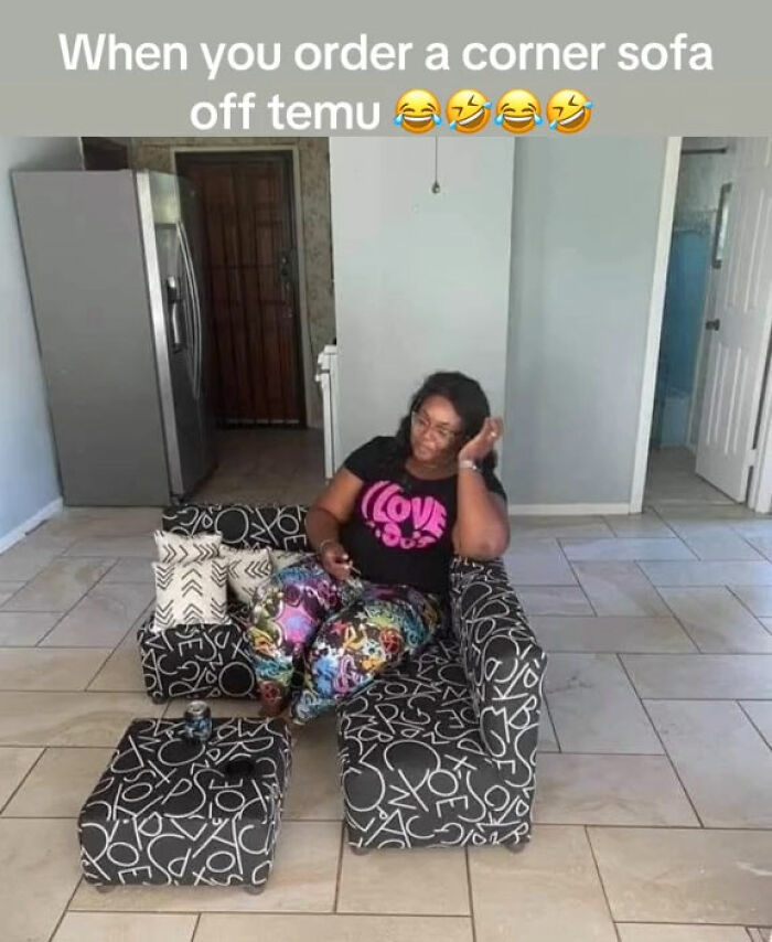 Woman sitting on a small corner sofa from Temu, looking amused after ordering furniture that didn’t meet expectations.