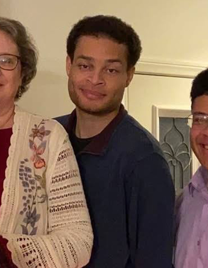 White House Correspondents' Dinner attacker, a California teacher, identified. A man with curly hair and blue sweater smiles.