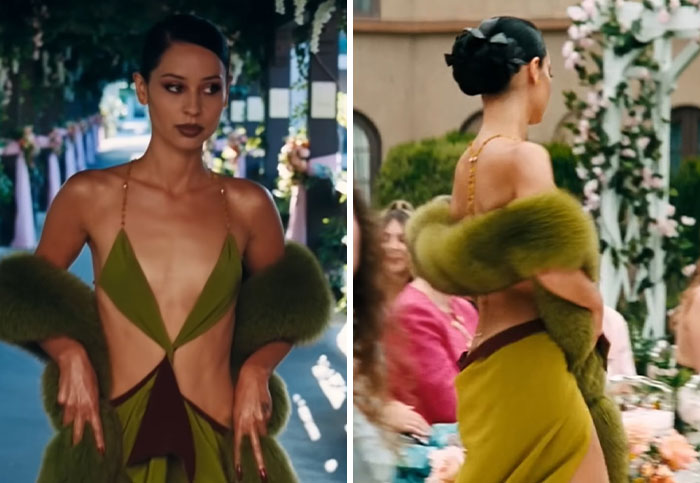 Alexa Demie as Maddy in a hideous outfit: a green cut-out dress with a faux fur boa at a chaotic wedding scene.