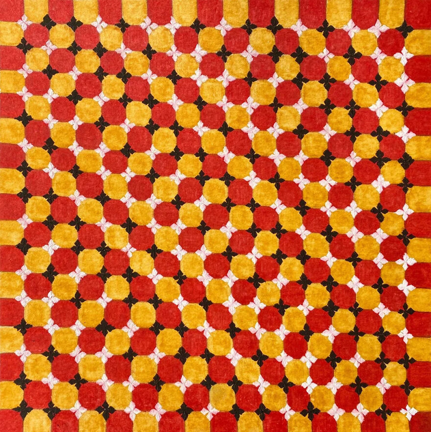 A grid of red and yellow circles with small white flowers. This brain-bending optical illusion explores neuroscience.
