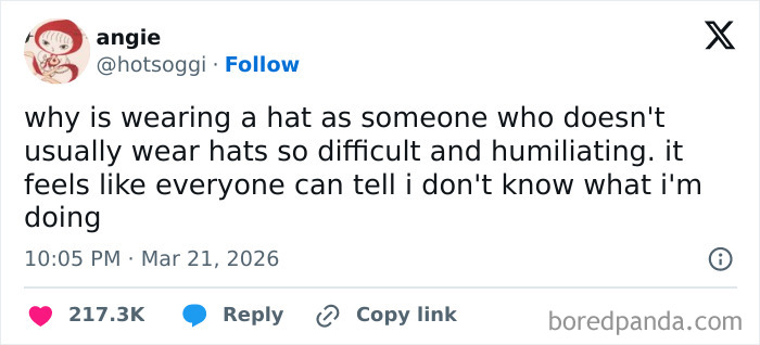 Tweet about the relatable struggle of wearing a hat for people who usually don’t wear hats, showing strangely specific feelings.