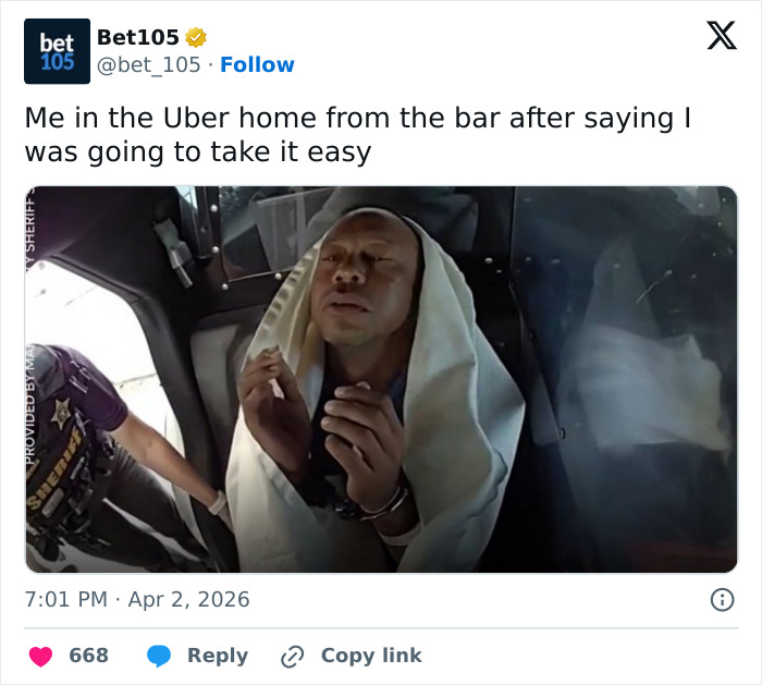 Man in handcuffs wrapped in a blanket inside a police vehicle, related to Tiger Woods arrest footage reactions.