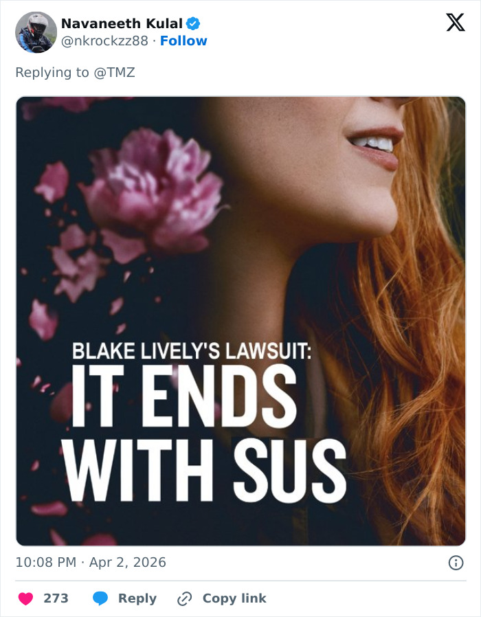 Close-up of a woman with red hair and pink flower petals falling, highlighting Blake Lively's lawsuit dismissal reaction.