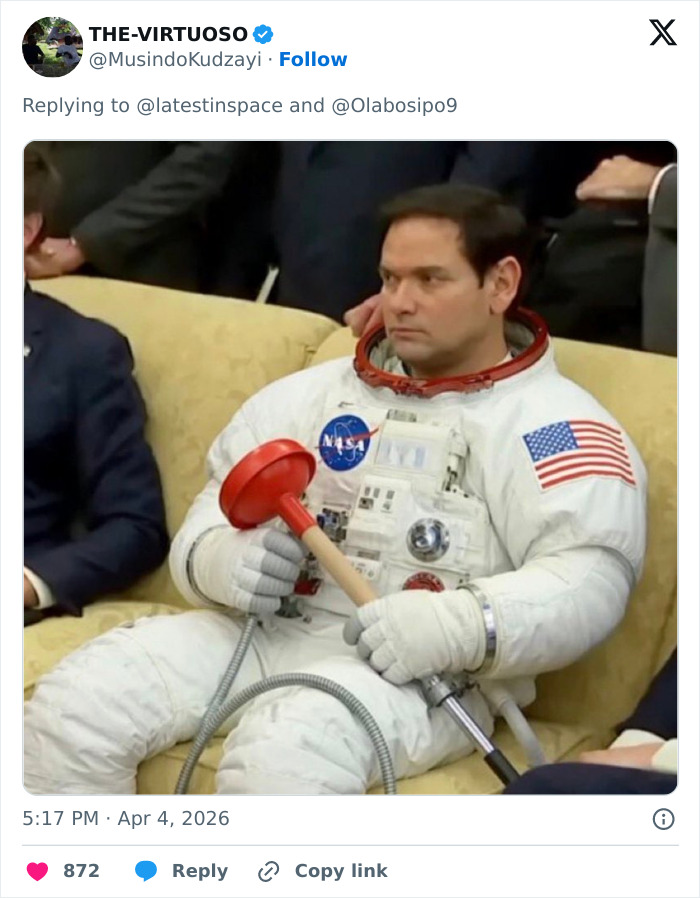Astronaut in a NASA suit sitting on a couch holding a red plunger, referencing space plumbing issues and toilet failure.