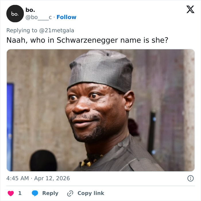 Man wearing a traditional hat smiling indoors with blurred background, related to Schwarzenegger and Teyana Taylor Coachella abs.