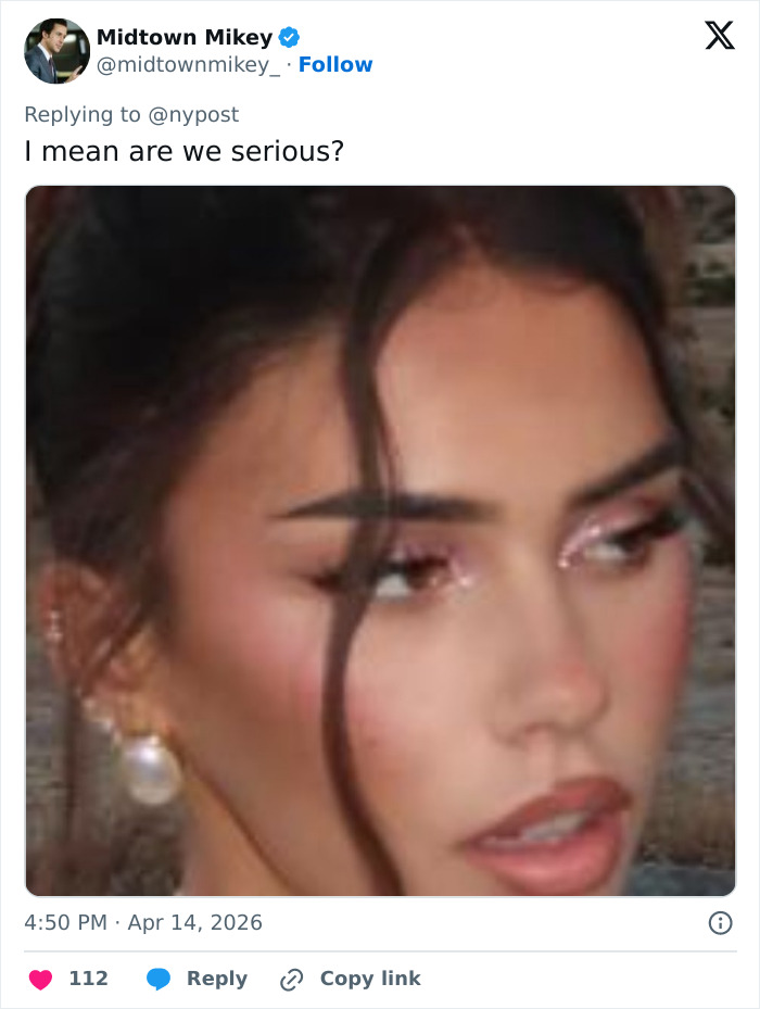 Coachella guest with glamorous makeup and pearl earring, turning heads as most beautiful girl alive at festival.