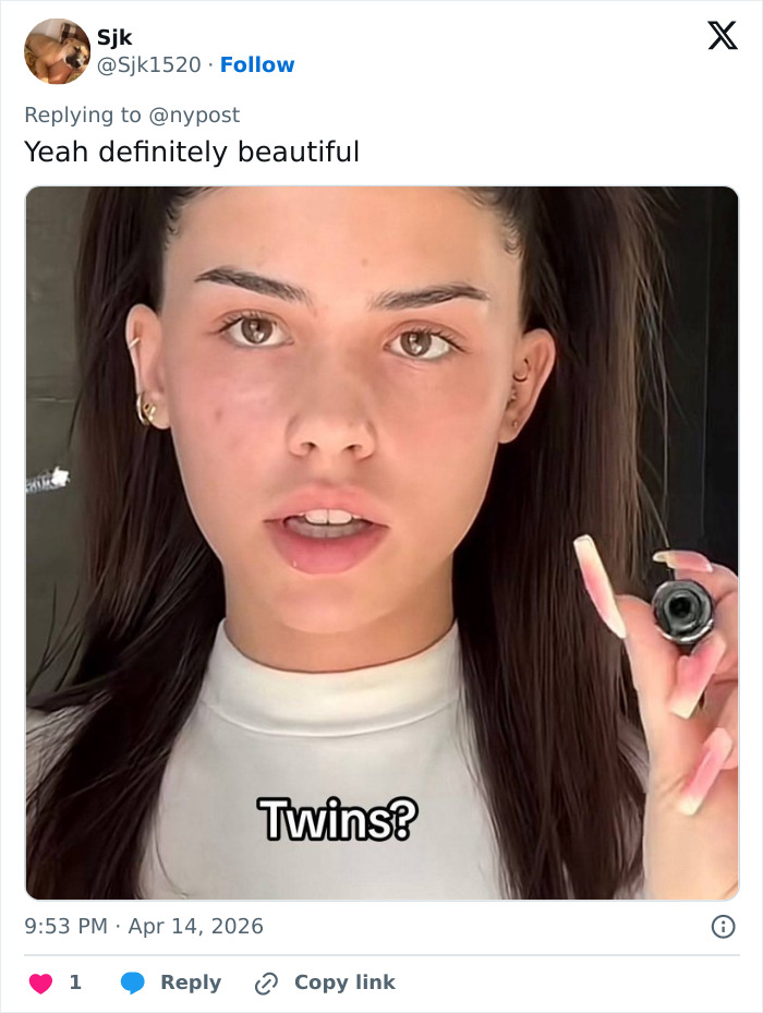 Young Coachella guest with long dark hair holding a small object, noted for being the most beautiful girl alive at the festival.