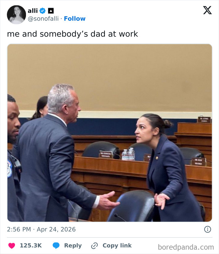 A tweet showing a woman in a blue suit with a surprised expression, facing a man. Hilarious tweets often capture such moments.