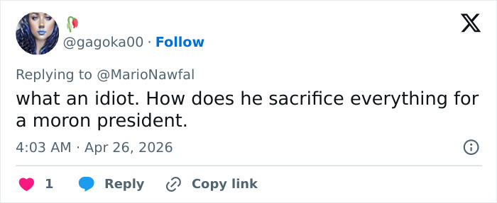 A tweet from @gagoka00, with an avatar of a woman with blue lips and hair, replying to @MarioNawfal. The tweet says, what an idiot. How does he sacrifice everything for a moron president. The comment reflects on the actions of the California teacher who attacked at the White House Correspondents Dinner.