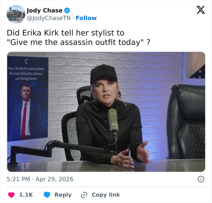 Erika Kirk in a black outfit and baseball cap, seated at a desk with a microphone, discussing her controversial video.