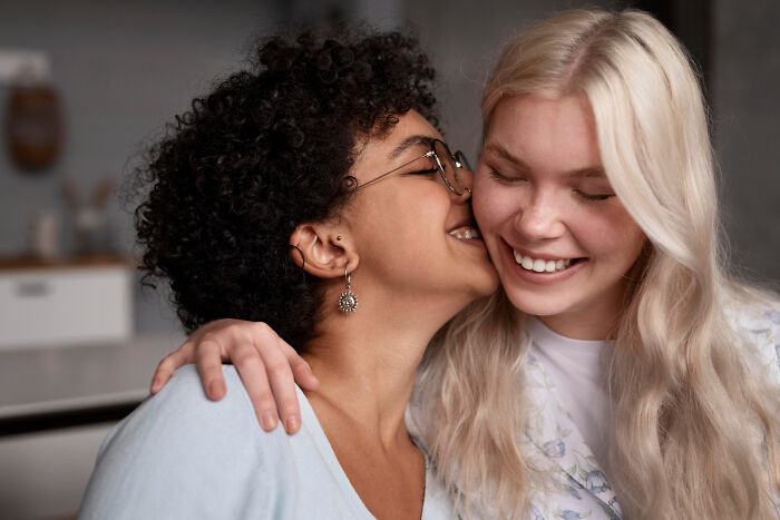 Smiling women sharing a happy moment, showing genuine friendship, a contrast to painful friendship betrayals.