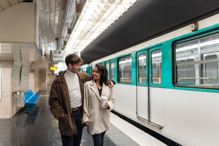Couple walking in a subway station, highlighting first dates with red flags, instant regret, and no callback experiences.