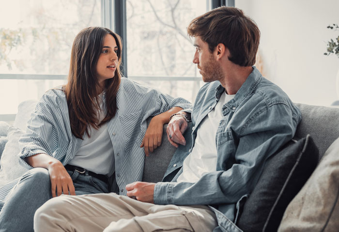 Mom and husband having a serious conversation on couch, highlighting husband being awesome to her but harsh to kids.