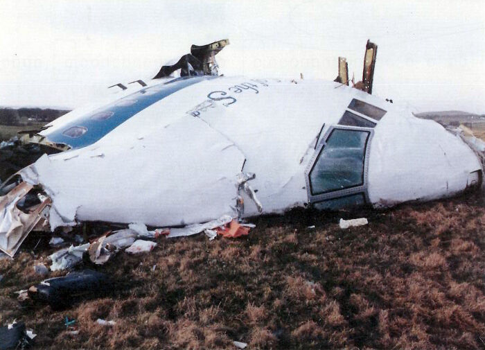 Wreckage of an aircraft on a field illustrating major historical events from 1960 to 2010 by year of birth.