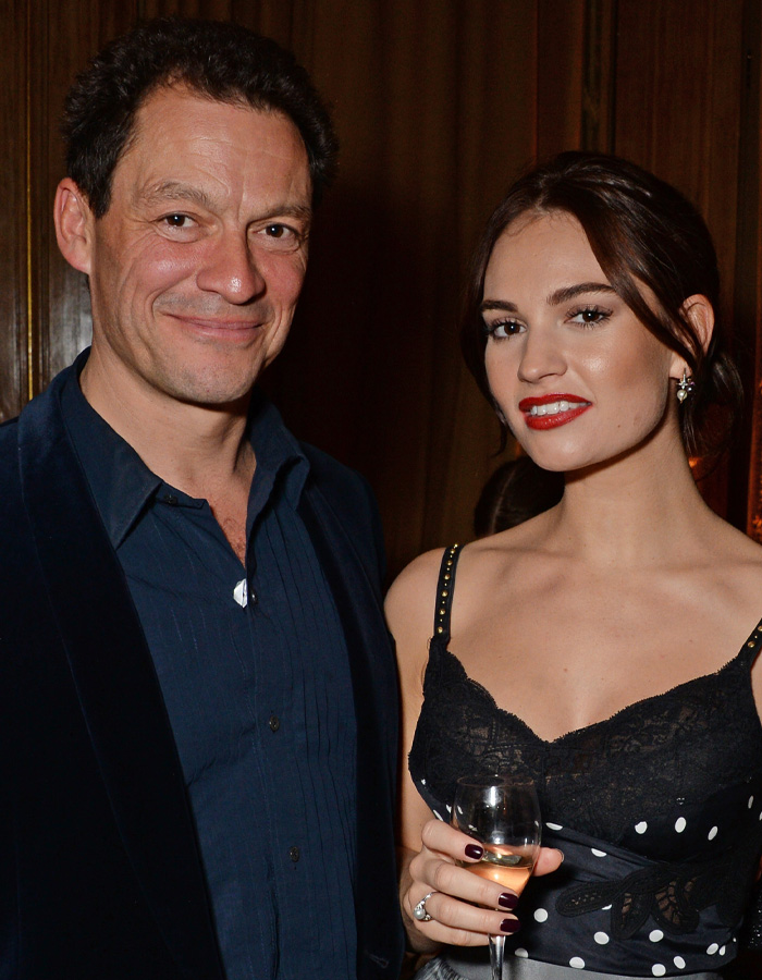 Dominic West and Lily James posing. She holds a champagne glass. These 6 years ago events sound unreal today.