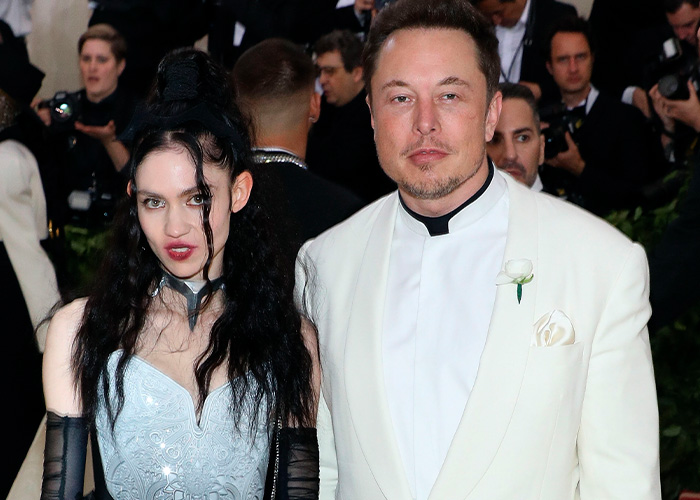 Elon Musk and Grimes at an event, 6 years ago. This photo captures a moment that seems completely unreal today.
