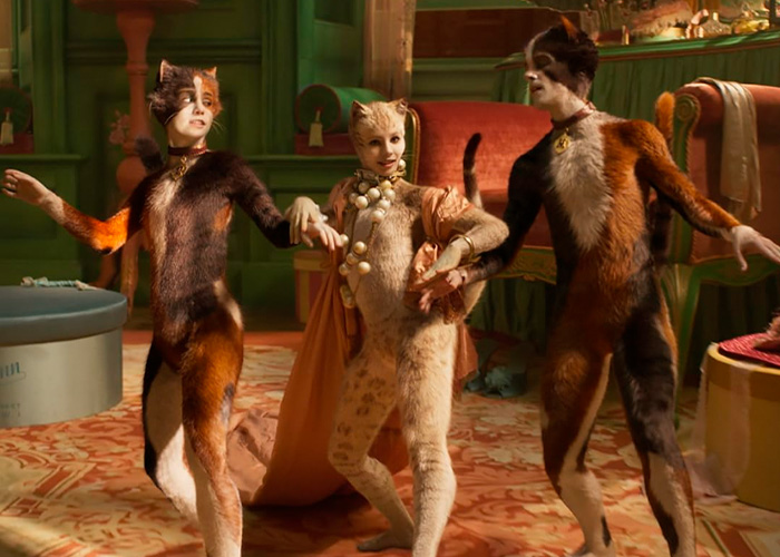 Three actors in cat costumes from the film Cats dancing. Something completely unreal 6 years ago.