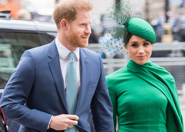 Prince Harry and Meghan Markle dressed formally. She wears a green dress and hat; he wears a blue suit. 6 years ago.