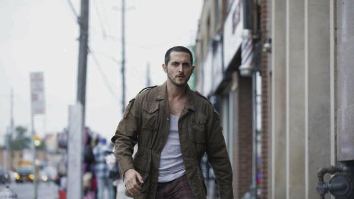 The Boys star walking on a city street, highlighting controversy over the actor's army history and fan boycott calls The Boys star walking on a city street, highlighting controversy over the actor's army history and fan boycott calls