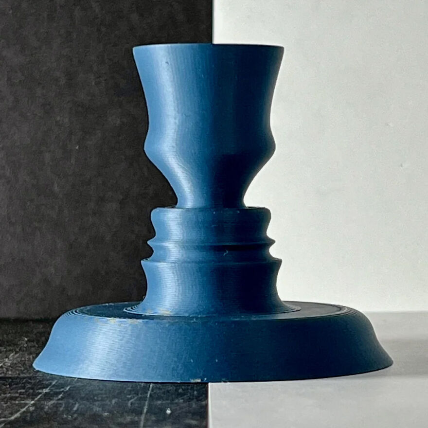 A blue Rubin's vase against a split black and white background, a classic example of brain-bending optical illusions.