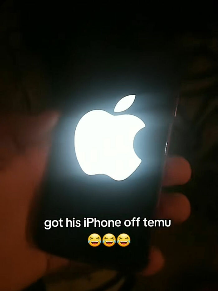 Hand holding iPhone with bright Apple logo glowing, illustrating a funny Temu ordering experience.