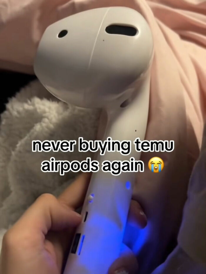 Close-up of a Temu airpod replica with malfunction issues highlighting a humorous lesson from Temu orders.