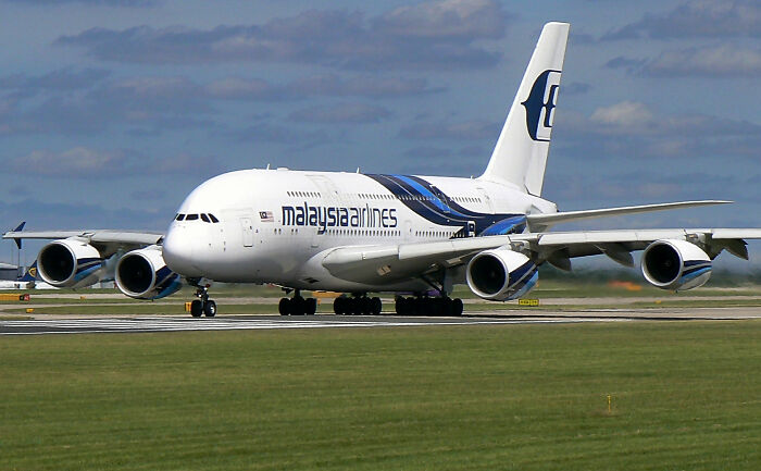 Malaysia Airlines airplane on runway illustrating PR mistakes that caused unexpected company backfire issues.