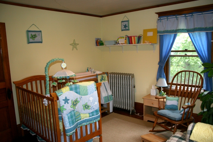 Cozy baby nursery with wooden crib and rocking chair reflecting mom&rsquo;s creepy behavior concerns and unsettling atmosphere.