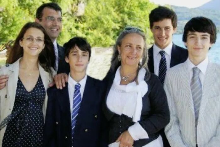 Family of six posing outdoors near water, representing people who lose sleep over creepy and mysterious things.