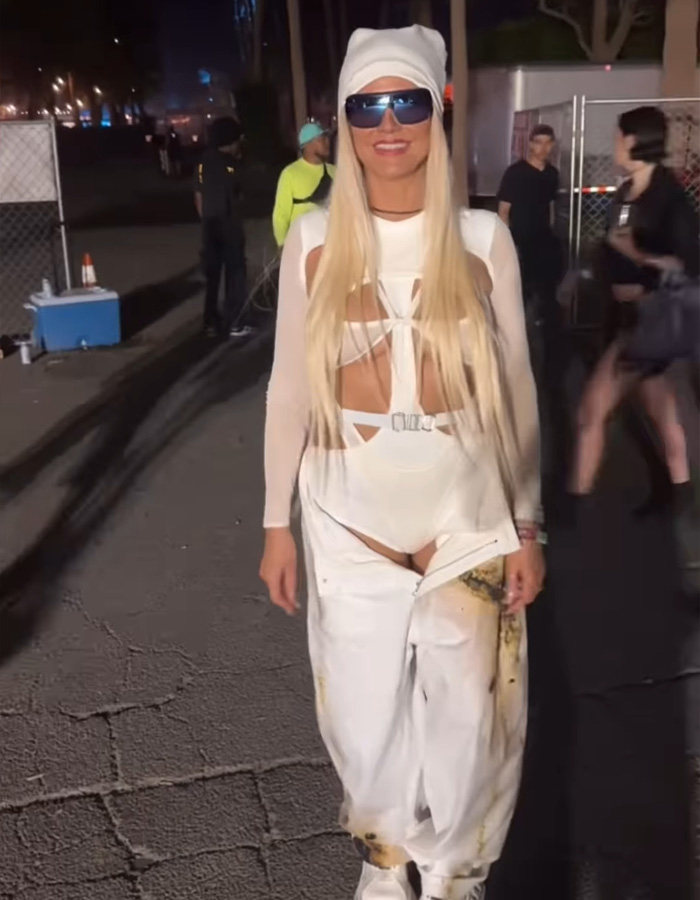 Heidi Klum at Coachella 2026 wearing an unrecognizable, edgy white outfit with sunglasses and long blonde hair.