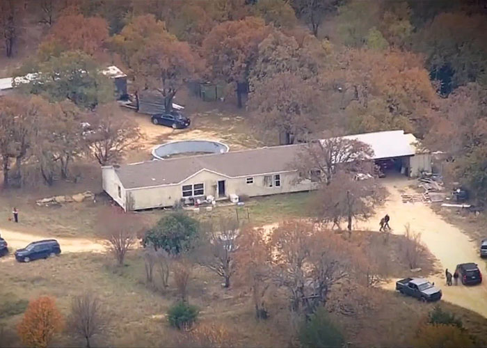 Aerial view of a rural property with a house, pool, and cars, central to the Athena Strand case and the FedEx driver.